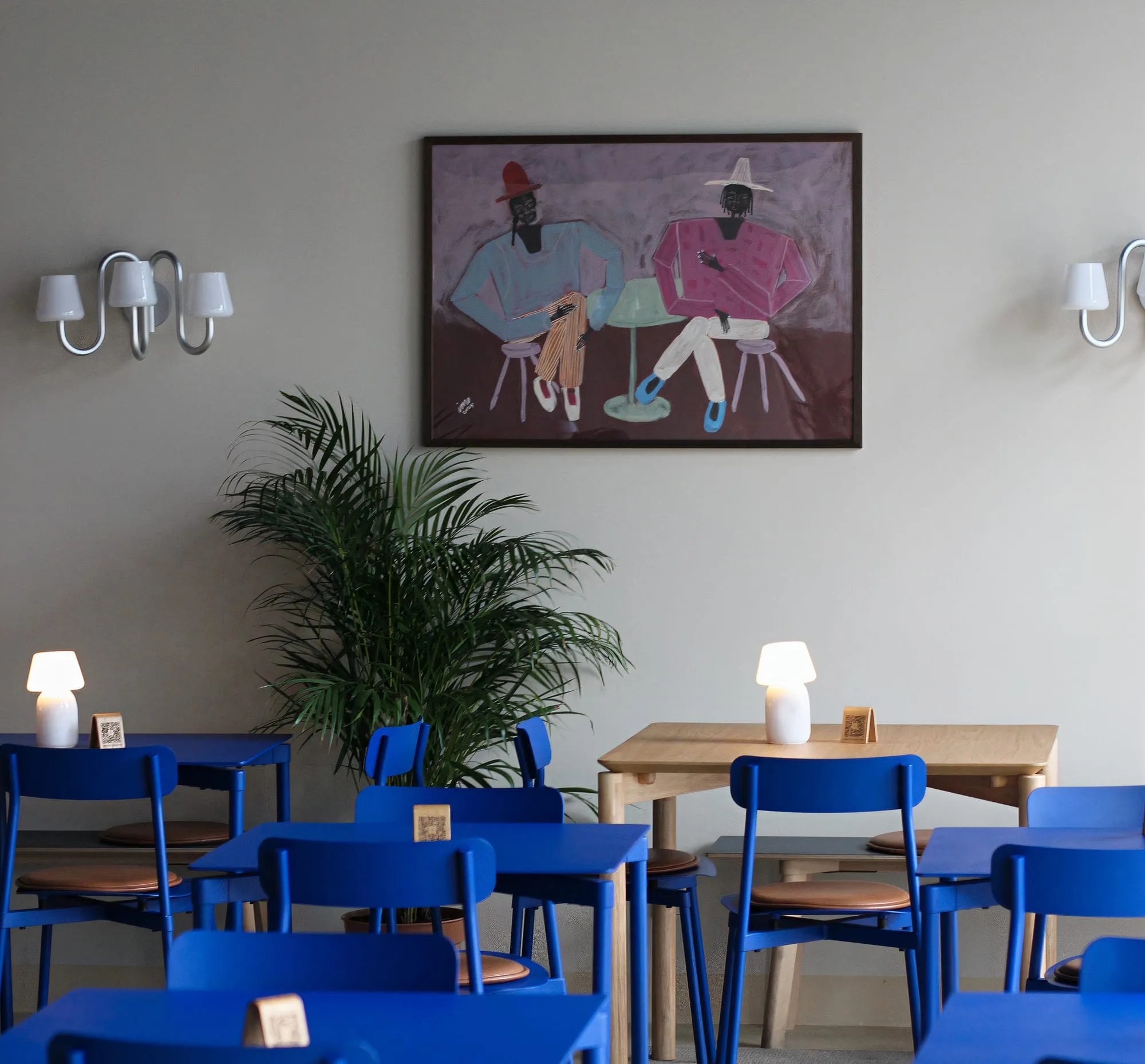 BQ Canteen interior with blue chairs